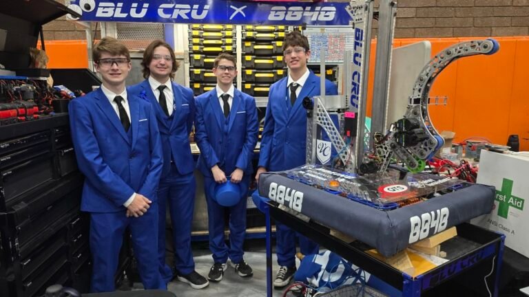 FRC Team 8848 Standing next to their robot